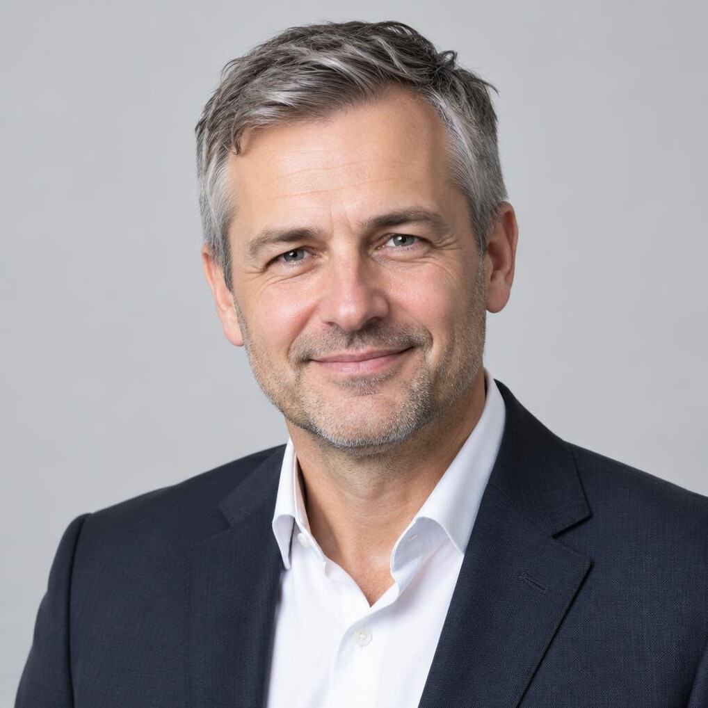Studio portrait of a Czech male event moderator in a suit